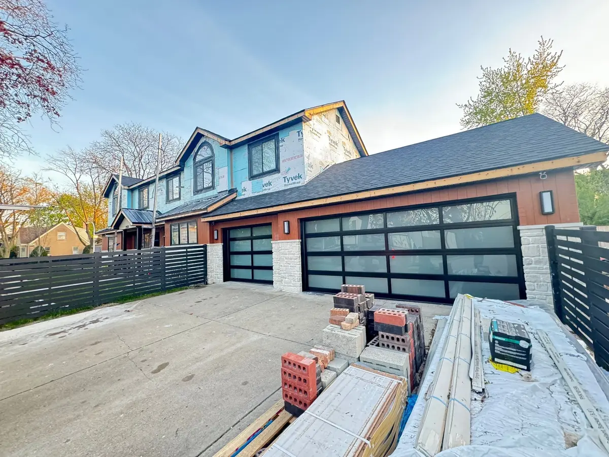 Full view glass garage doors on a contemporary home
