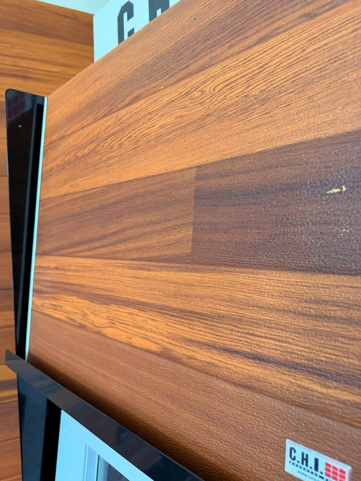 Showroom sample of a cedar tone plank garage door