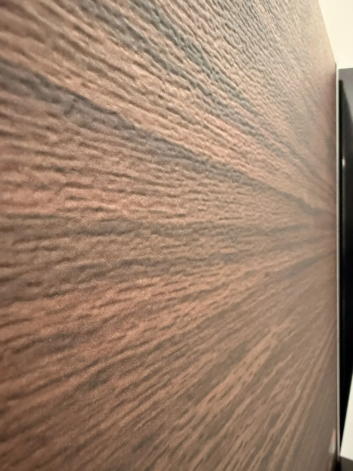 Close-up of a wood grain finish on a garage door sample