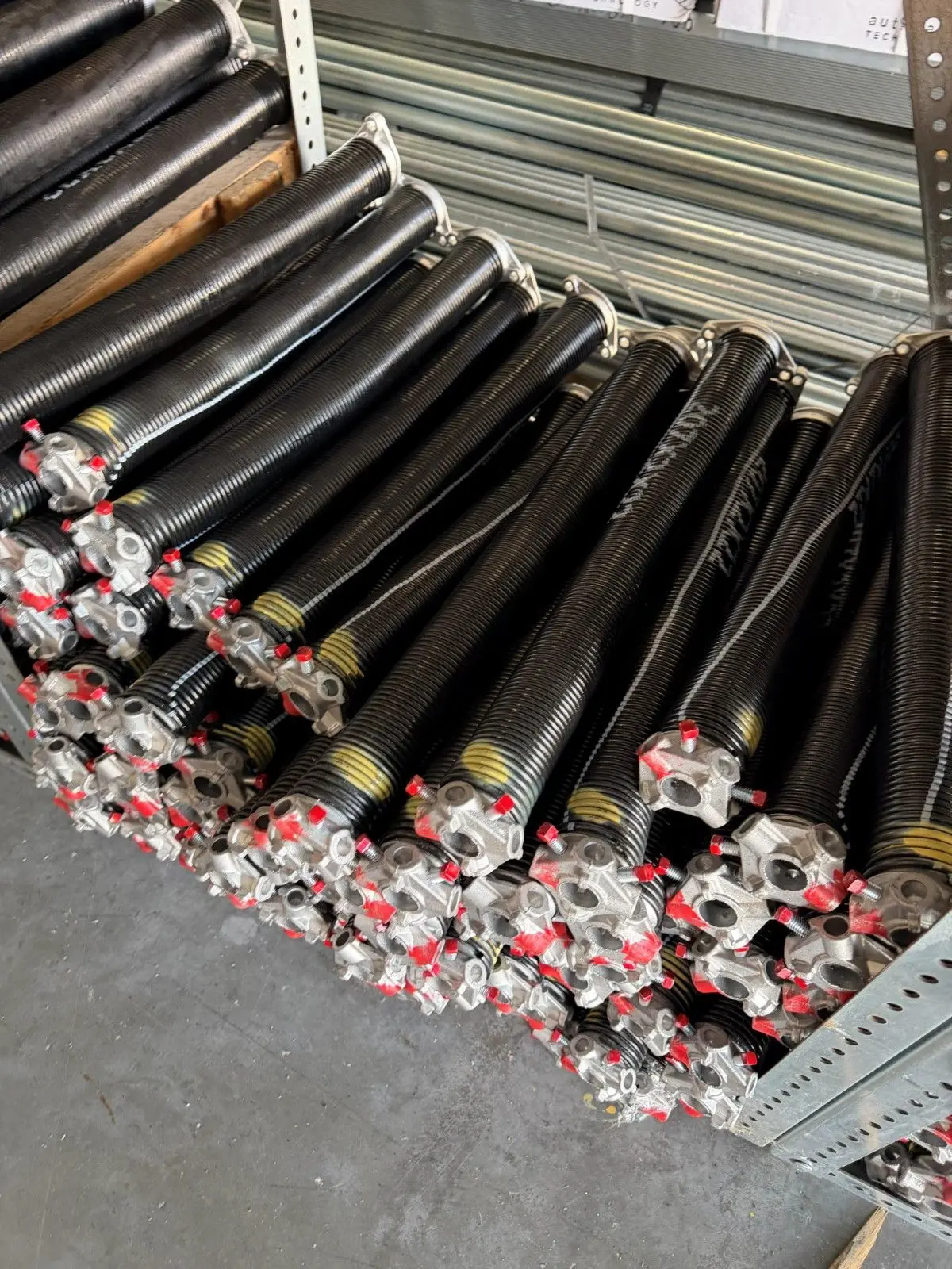 Stock of garage door torsion springs in different sizes